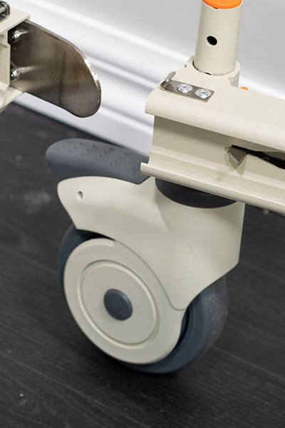 Close-up of the stable, easy-to-roll caster wheels on a mobility chair, highlighting the ease of movement provided by the design.