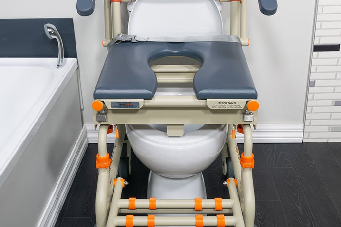 A Showerbuddy toilet chair system positioned over a standard toilet, featuring height adjustability to accommodate different toilet sizes for versatile use.
