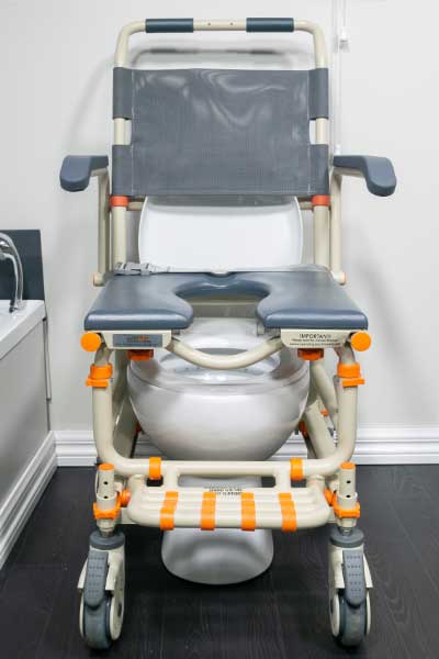 Showerbuddy mobility chair designed for use over a toilet, emphasizing the secure design to maintain a safe body position.