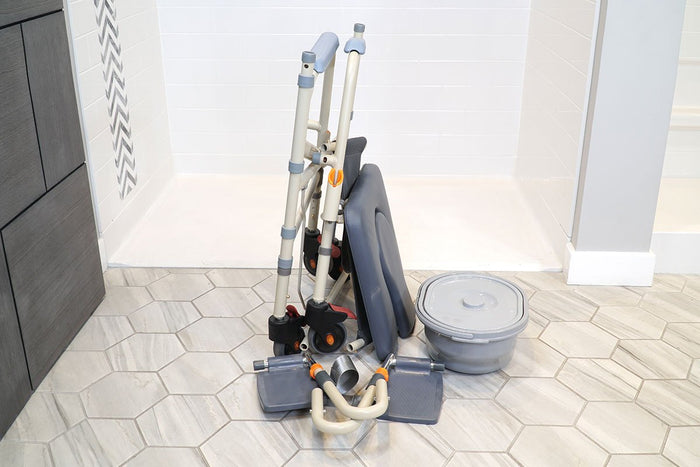 Image of a folded Showerbuddy mobility chair and commode, ready for travel, with the text "Our Helpful Travel Guides" suggesting resources for traveling with mobility aids.