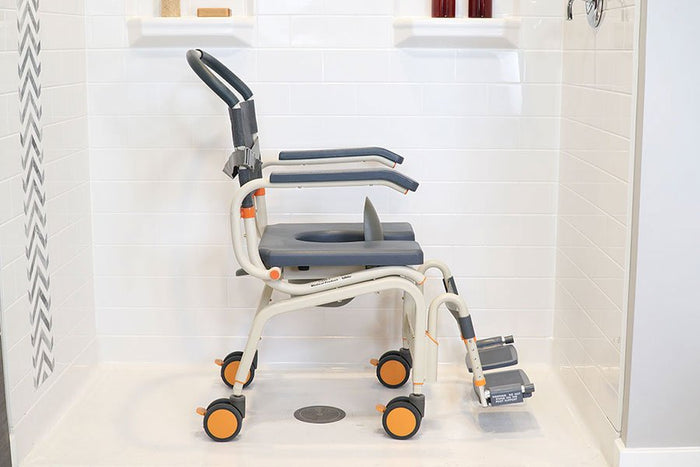 Image of the MODEL SB6c "Roll-inBuddy Lite", a versatile shower and commode chair designed for family use, highlighting its multiple functions and configurations.