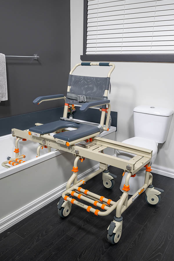 TubBuddy bathtub transfer chair by Showerbuddy, showcasing its extendable bridge and secure seating mechanism, designed for enabling access to traditional bathtubs for users with mobility issues.