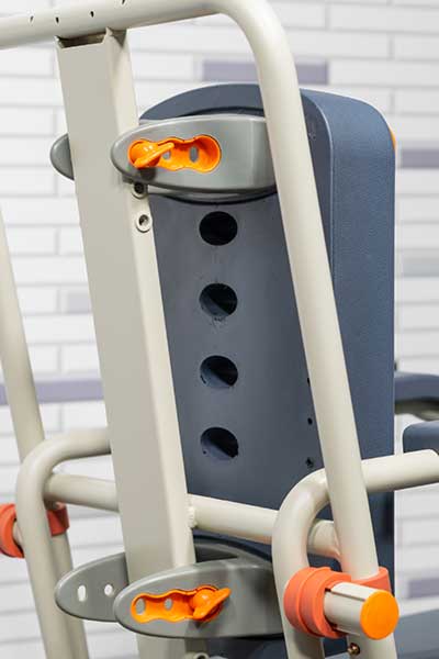 Image showing the backrest of a Showerbuddy chair with multiple holes for accessory attachments, emphasizing the chair's customization with optional accessories.