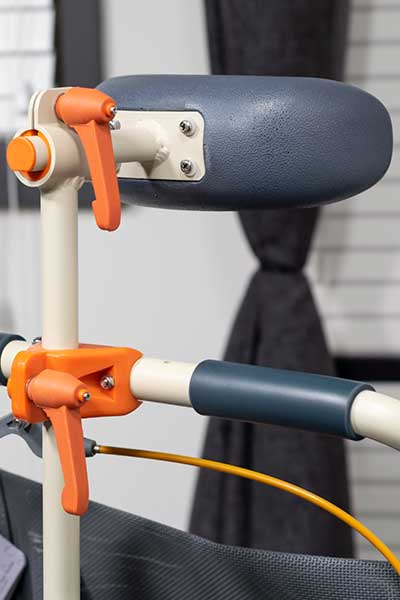 Image showing the armrest and safety handle of a Showerbuddy chair, highlighting the additional accessories for enhanced user support.
