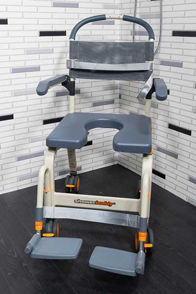 Showerbuddy chair displayed from a front-facing angle, emphasizing the benefit of no manual lifting and reduced hazards for users.